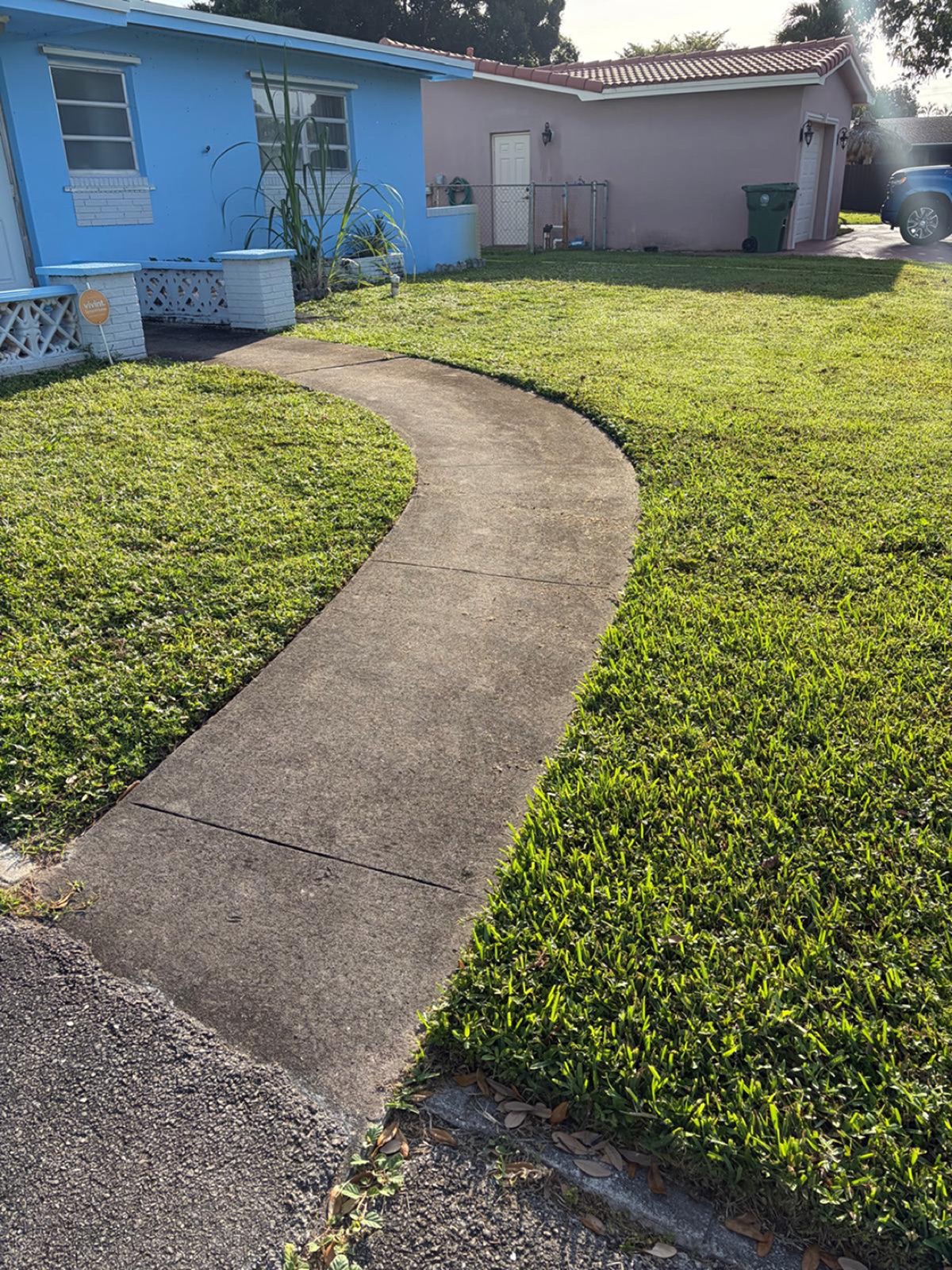 Stained concrete walkway before pressure washing in Pembroke Pines, FL